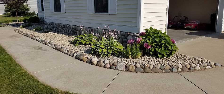 This landscaping bed in Freeland uses rock ground cover for protection.