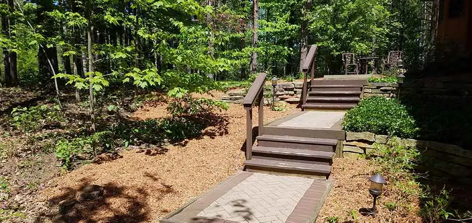 Cedar mulch has been installed on either side of the stairway of this Midland property.